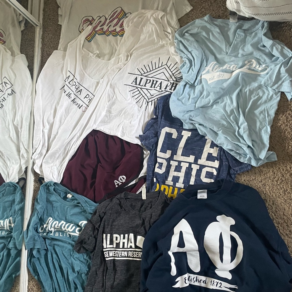 Medium and large shirts, sweatshirt, workout shorts. Alpha Phi